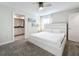 King-size bed, ceiling fan, en-suite bathroom access at 1264 Challenge Dr, Davenport, FL 33896