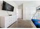 Bedroom with TV, dresser, and bunk beds at 1264 Challenge Dr, Davenport, FL 33896