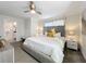 King-size bed, en-suite bathroom, and ample natural light at 1264 Challenge Dr, Davenport, FL 33896