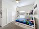 Bunk beds, closet, and Marvel-themed decor at 1264 Challenge Dr, Davenport, FL 33896