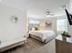 Spacious primary bedroom with king-size bed and en-suite bathroom at 1264 Challenge Dr, Davenport, FL 33896