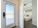 Bright entryway with frosted glass door and view of bedroom at 1264 Challenge Dr, Davenport, FL 33896