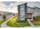 Modern two-story townhome with stone accents and a welcoming front porch at 1264 Challenge Dr, Davenport, FL 33896