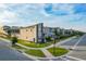 Modern two-story townhome with stone accents and a private backyard at 1264 Challenge Dr, Davenport, FL 33896
