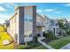 Modern two-story townhome with stone accents and a welcoming front porch at 1264 Challenge Dr, Davenport, FL 33896