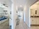Hallway with glass-top table, leading to bedrooms and living area at 1264 Challenge Dr, Davenport, FL 33896