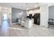 Modern kitchen with stainless steel appliances and breakfast bar at 1264 Challenge Dr, Davenport, FL 33896