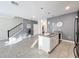 Modern kitchen with white cabinets, gray countertops, and stainless steel appliances at 1264 Challenge Dr, Davenport, FL 33896