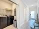 Laundry room with washer, dryer, and shelving at 1264 Challenge Dr, Davenport, FL 33896