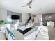 Living area with white sectional and a textured wall at 1264 Challenge Dr, Davenport, FL 33896