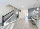 Open concept living area with grey walls and tile floors at 1264 Challenge Dr, Davenport, FL 33896