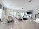 Open concept living and dining area with modern decor at 1264 Challenge Dr, Davenport, FL 33896