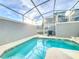 Private screened pool with patio furniture and grill at 1264 Challenge Dr, Davenport, FL 33896