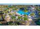 Large resort-style pool with lounge chairs and palm trees at 1264 Challenge Dr, Davenport, FL 33896