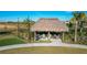 Relax in the shade of this thatched palapa at 1264 Challenge Dr, Davenport, FL 33896