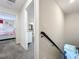 Upstairs hallway with access to bedrooms and bathroom at 1264 Challenge Dr, Davenport, FL 33896