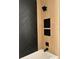 Modern bathroom with black and wood tile, bathtub at 19527 Quinlan St, Orlando, FL 32833