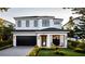 Stunning two-story home with a modern design and landscaped front yard at 227 Page St, Orlando, FL 32806
