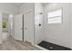 Modern bathroom with a walk-in shower, tile flooring, and a large window at 4479 Sw 170Th Rd, Ocala, FL 34473