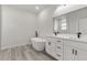 Modern bathroom with double vanity, soaking tub, and marble shower at 4479 Sw 170Th Rd, Ocala, FL 34473
