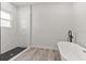 Clean bathroom with a freestanding tub and marble shower at 4479 Sw 170Th Rd, Ocala, FL 34473