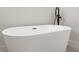 Close-up view of a modern freestanding bathtub at 4479 Sw 170Th Rd, Ocala, FL 34473