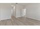Spacious bedroom with wood-look floors and access to other rooms at 4479 Sw 170Th Rd, Ocala, FL 34473