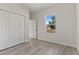 Bright bedroom with a window and double door closet at 4479 Sw 170Th Rd, Ocala, FL 34473