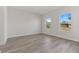 Spacious bedroom with vinyl flooring and two large windows at 4479 Sw 170Th Rd, Ocala, FL 34473