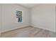 Spacious bedroom with hardwood floors and a window at 4479 Sw 170Th Rd, Ocala, FL 34473