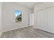Charming bedroom with a large window and double-door closet at 4479 Sw 170Th Rd, Ocala, FL 34473
