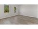 Bright bedroom with two large windows and wood-look floors at 4479 Sw 170Th Rd, Ocala, FL 34473
