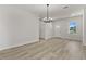 Bright dining room with hardwood floors and chandelier at 4479 Sw 170Th Rd, Ocala, FL 34473