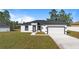 Newly constructed home with a modern exterior and attached garage at 4479 Sw 170Th Rd, Ocala, FL 34473