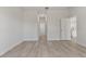 Bright hallway with wood-look floors and doors to other rooms at 4479 Sw 170Th Rd, Ocala, FL 34473