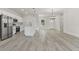 Open concept kitchen with island, stainless steel appliances, and white cabinets at 4479 Sw 170Th Rd, Ocala, FL 34473