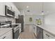 Modern kitchen with stainless steel appliances and white cabinets at 4479 Sw 170Th Rd, Ocala, FL 34473