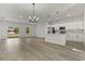 Open concept kitchen with island, stainless steel appliances, and white cabinetry at 4479 Sw 170Th Rd, Ocala, FL 34473