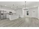 Open concept kitchen boasts stainless steel appliances and an island at 4479 Sw 170Th Rd, Ocala, FL 34473