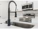 Modern kitchen sink and faucet at 4479 Sw 170Th Rd, Ocala, FL 34473