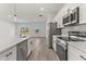 Modern kitchen with stainless steel appliances and white cabinetry at 4479 Sw 170Th Rd, Ocala, FL 34473