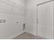 Bright laundry room features shelving and a modern door at 4479 Sw 170Th Rd, Ocala, FL 34473