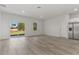 Open concept living room and kitchen with hardwood floors at 4479 Sw 170Th Rd, Ocala, FL 34473