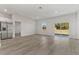 Bright living room with hardwood floors and sliding glass doors to backyard at 4479 Sw 170Th Rd, Ocala, FL 34473