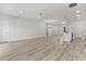 Open concept living area with hardwood floors, kitchen and island at 4479 Sw 170Th Rd, Ocala, FL 34473