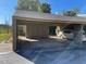 Covered carport with parking space for one vehicle at 5466 Pine Creek Dr # 2002, Orlando, FL 32811