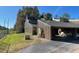 Condo exterior showcasing a unique roofline and landscaping at 5466 Pine Creek Dr # 2002, Orlando, FL 32811