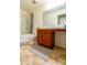 Clean bathroom with tub, shower, and wood vanity at 591 Preserve Pointe Blvd, Davenport, FL 33837