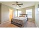 Spacious bedroom with a queen-size bed and an ensuite bathroom at 591 Preserve Pointe Blvd, Davenport, FL 33837