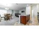 Open concept dining area with kitchen island and living room at 591 Preserve Pointe Blvd, Davenport, FL 33837